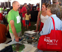 NDIIPP staff speak with the general public about saving personal digital information at the 2010 National Book Festival. 