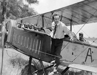 Image of Harry Houdini on an airplane